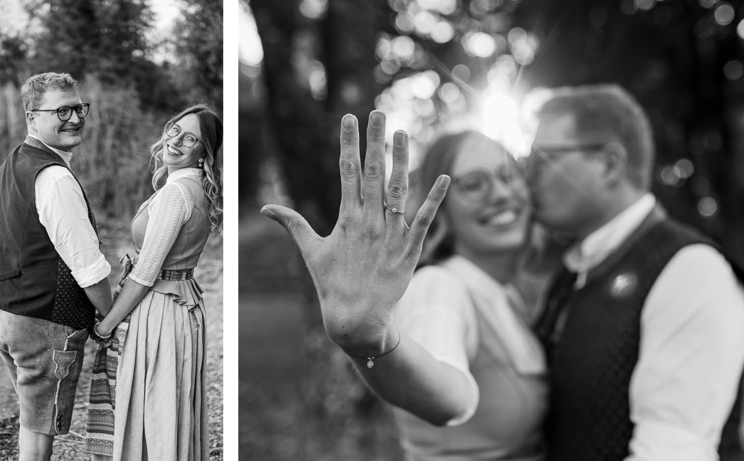 Dieses romantische Paarportrait von Mica Zeitz zeigt ein fröhliches Brautpaar in traditioneller Tracht, das sich liebevoll in der Natur betrachtet. Der Fokus liegt auf dem Verlobungsring der Braut und dem strahlenden Lächeln des Paares, das die Freude ihrer bevorstehenden Hochzeit widerspiegelt.